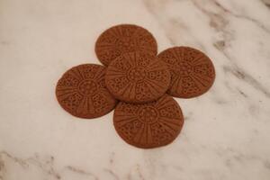 Close-up of delicious chocolate cookies arranged on a surface. photo