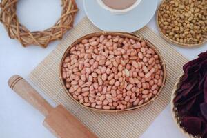 Fresh Peanuts in a Rustic Bowl, Ready for a Delicious Snack photo