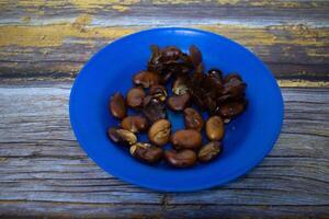 Contains koro beans placed on a rustic wooden table photo