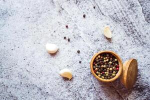 a mixture of peppers and garlic are on the table photo