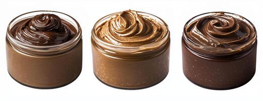 Glass jars of nut and chocolate hazelnut spread isolated on white background photo