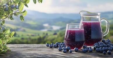 Blueberry juice in glass and pitcher with berries on wooden table, scenic background, copy space photo