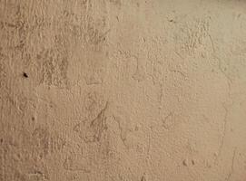 texture, pattern, rough and uneven yellow wall background, creating a lively and abstract background. photo