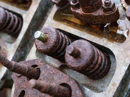 close-up rusty shock machinery rusty and broken machine parts photo