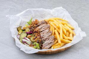 Pulled Pork Salad with Fries Pickles and Crispy Onions in Bamboo Tray photo