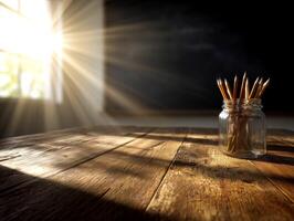 Sunlit rustic table with jar of pencils, warm and cozy ambiance. photo