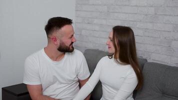 Loving couple embracing, young man and woman sharing tender moment, fostering a warm and intimate atmosphere filled with love, connection, and shared joy lifestyle video