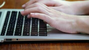 Hands typing on laptop keyboard, showing digital work, communication, creativity, and modern technology in everyday life, The shot highlights precision and focus, typing on keyboard video
