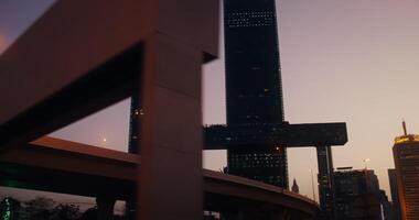 A view of skyscrapers with light in the windows in the rays of the setting sun photo