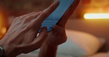 Man hands are typing text on a mobile phone. Close-up of a smartphone screen. Unrecognizable person, no face photo
