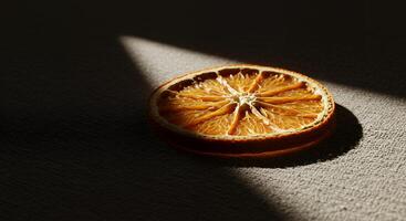 An orange slice on a table photo