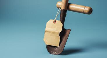 A shovel with a tag hanging from it photo