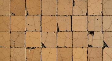 A close up of a wall with cracks in it photo