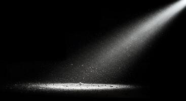 Black and white photo of a spotlight shining on a black background