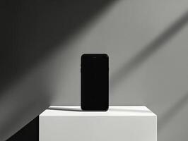 Smartphone on white pedestal photo