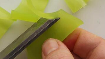 Smooth slicing of a piece of yellow soap with smooth texture and detailed video