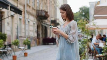 Tourist traveler woman girl using looking smartphone search a way on map in mobile navigator app video