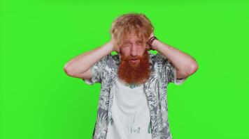 Annoyed irritated young man covering ears gesturing no avoiding advice ignoring noise loud voices video