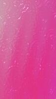 Vertical water ripples create an abstract pink textured background. Perfect for artistic backgrounds, naturethemed designs, or calming visuals. video