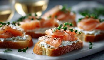 Smoked salmon appetizer on bread with cheese and herbs photo