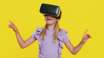 Child kid girl using headset helmet app to play simulation game, watching virtual reality 3D video