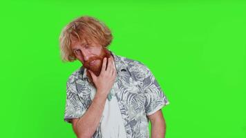 Smiling playful happy caucasian man blinking eye, looking at camera with smile, winking, flirting video