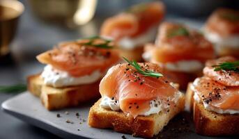 Smoked salmon on toasts with cream cheese and herbs photo