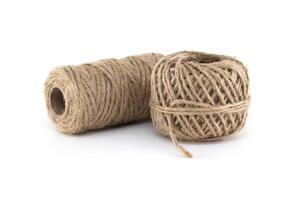 Close-up shot of two spools of natural twine on a pristine white background. photo
