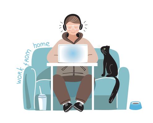 A man works on a laptop from home