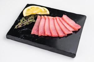 Premium quality tuna sashimi, ideal for a refreshing appetizer or light meal that delights the senses. isolated on white background. top view photo