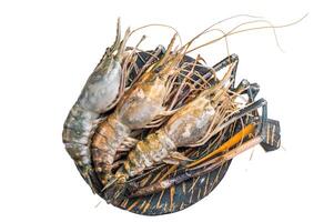 Uncooked rosenbergii fresh water shrimp ready for preparation, perfect for chefs looking to create exquisite seafood dishes. isolated on white background. top view photo