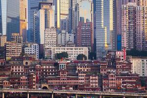 Chongqing, China-APR 02, 2025- Cityscape of the famous downtown shopping complex Hongyadong with illuminated bridge and highrise building in Chongqing photo