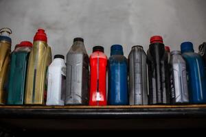 a shelf with many different types of bottles photo