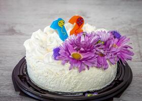 moscow, russia, 21.09.2015 A cake with a candle on it and a flower on top photo