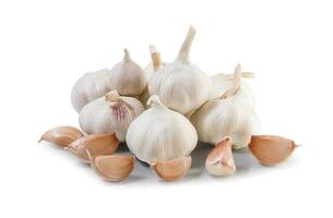 Garlic bulb and clove isolated, Garlic bulbs with sliced cloves on white background. White garlic bulb composition. With clipping path. Full depth of field. photo