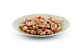 Stir-fried Clams with Chilli Paste isolated on white background with clipping path. Stir fried striped clams with basil, chilli paste, garlic and fresh chilies, thai seafood. photo