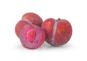Red Plum, One and a half of purple plum fruit isolated on white background with clipping path photo