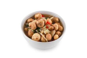 Thai Mushroom curry Hygroscopic earthstar or False earthstar in black tray isolated on white background with clipping path, Puffball Mushrooms, Astraeus hygrometricus. photo