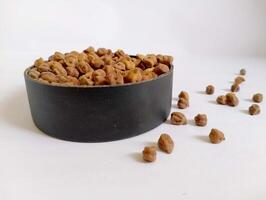 Nutritious black chickpeas displayed in simple bowl. photo