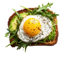 Avocado toast topped with fried egg and arugula for breakfast png