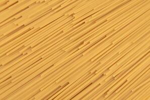 Thin spaghetti sgattered as background photo