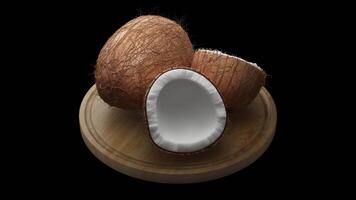 Looping animation around a composition of coconuts lying on a wooden board. video