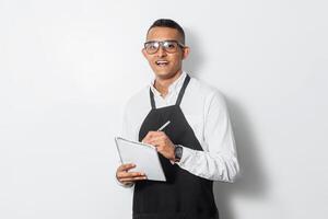 Portrait of a waiter man using a notepad isolated on white background. photo