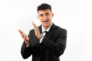 Portrait of a business man clapping and applauding happy and joyful, smiling proud hands together. photo