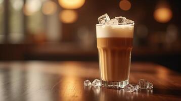 Iced coffee beverage in a tall glass, garnished with ice cubes. photo
