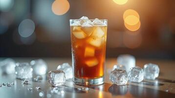 A refreshing beverage with ice cubes against a blurred background. photo