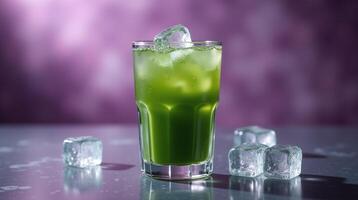 Vibrant green beverage with ice cubes on a reflective surface. photo