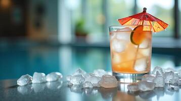 A refreshing cocktail with ice and a lemon slice, accompanied by a miniature umbrella. photo