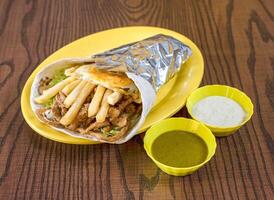 Delicious Beef Shawarma Wrap with Crispy Fries and a Fried Egg photo