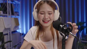 Podcast host listening to viewer's question during live show, medium close up angle video